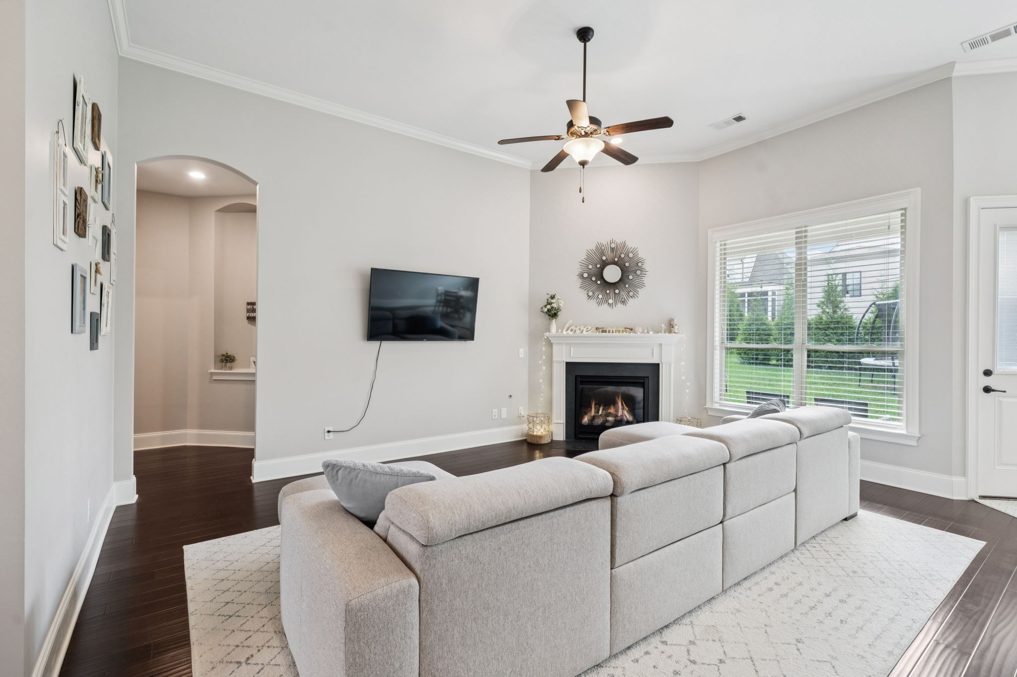 3639 Martins Mill Road Thompson's Station, TN 37179 - Photo 16 of 35 a living room with furniture a fireplace and a flat screen tv