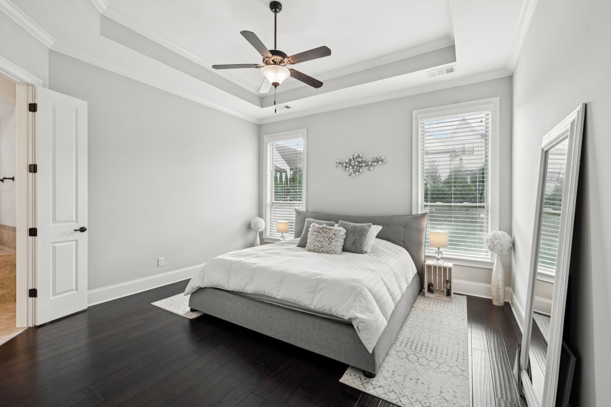 3639 Martins Mill Road Thompson's Station, TN 37179 - Photo 20 of 35 a bedroom with a large bed chandelier and a window