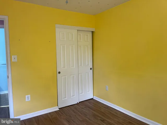 a view of a small space with wooden floor