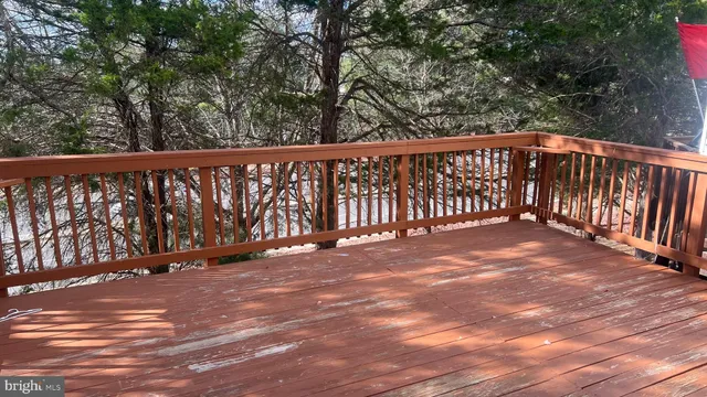 a view of deck with wooden floor and fence