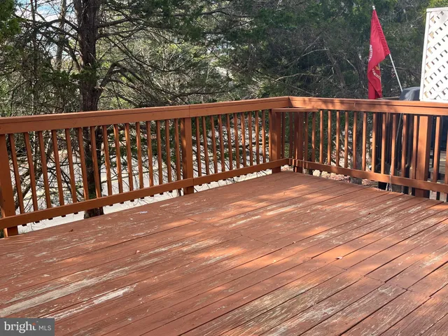 a view of hallway with wooden floor