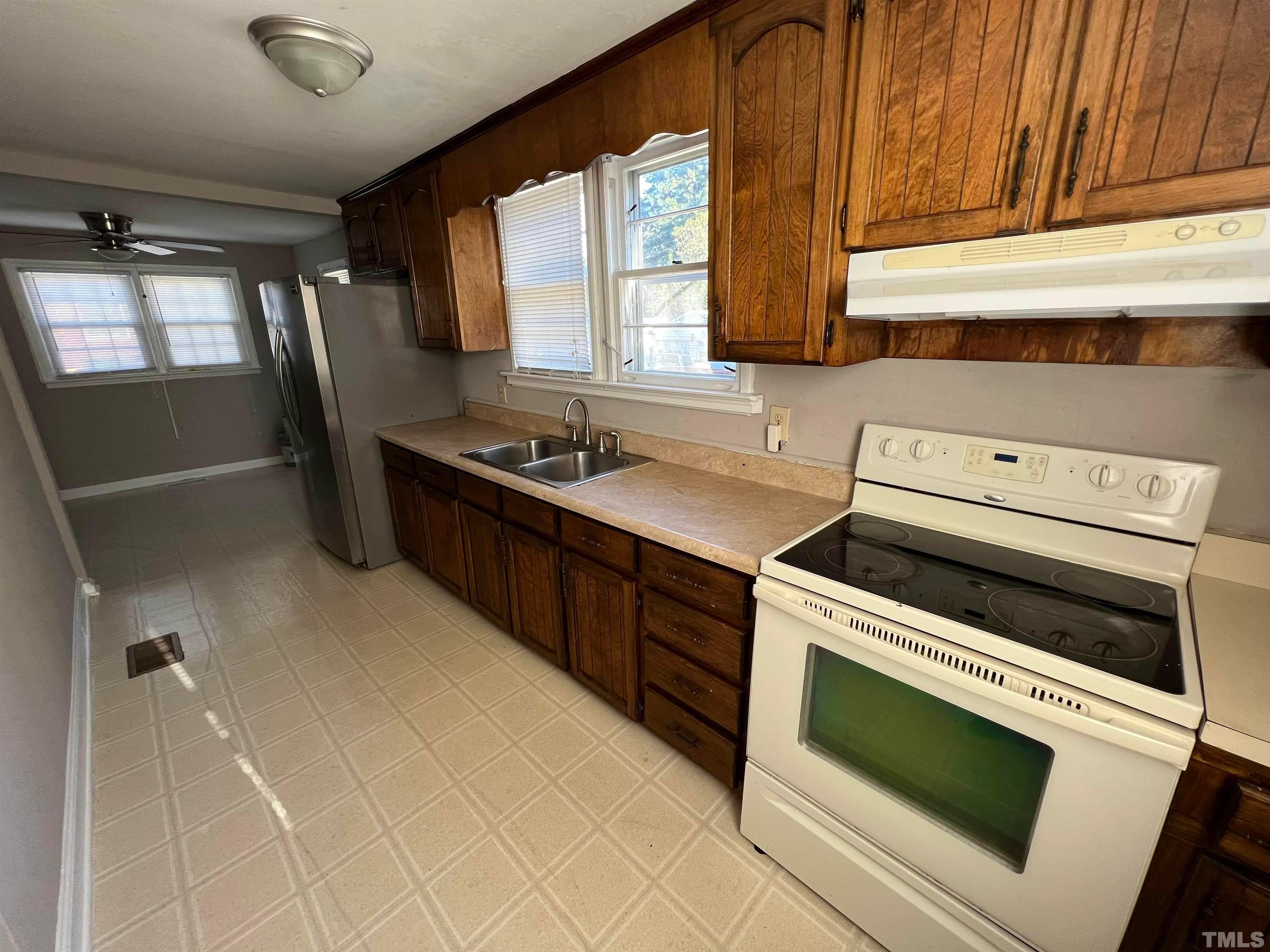 4359 Old Poole Road Raleigh, NC 27610 - Photo 11 of 13 a kitchen with a stove microwave and sink