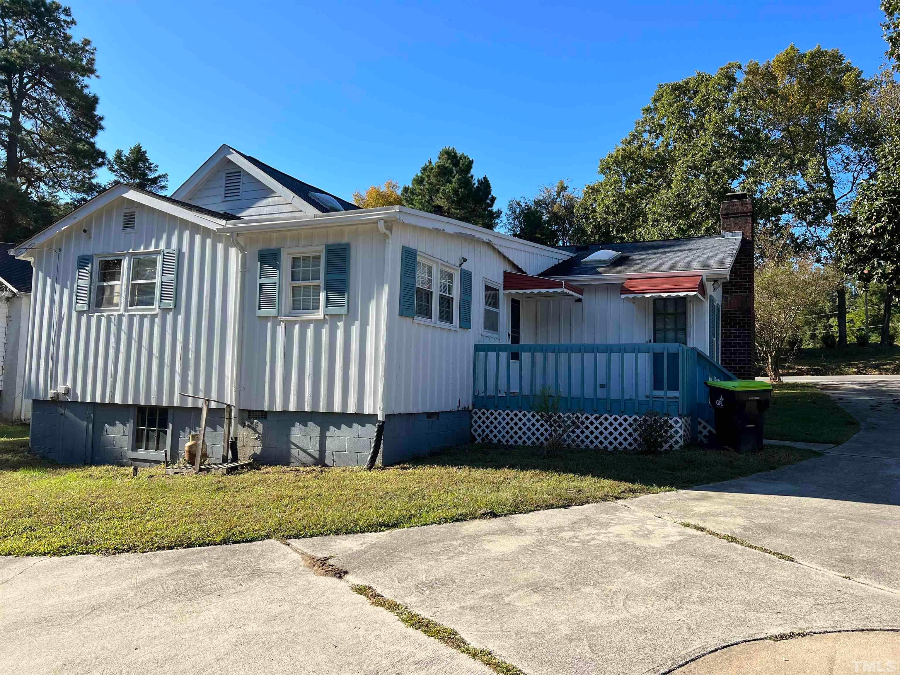 4359 Old Poole Road Raleigh, NC 27610 - Photo 3 of 13 a front view of a house with a garden and pathway