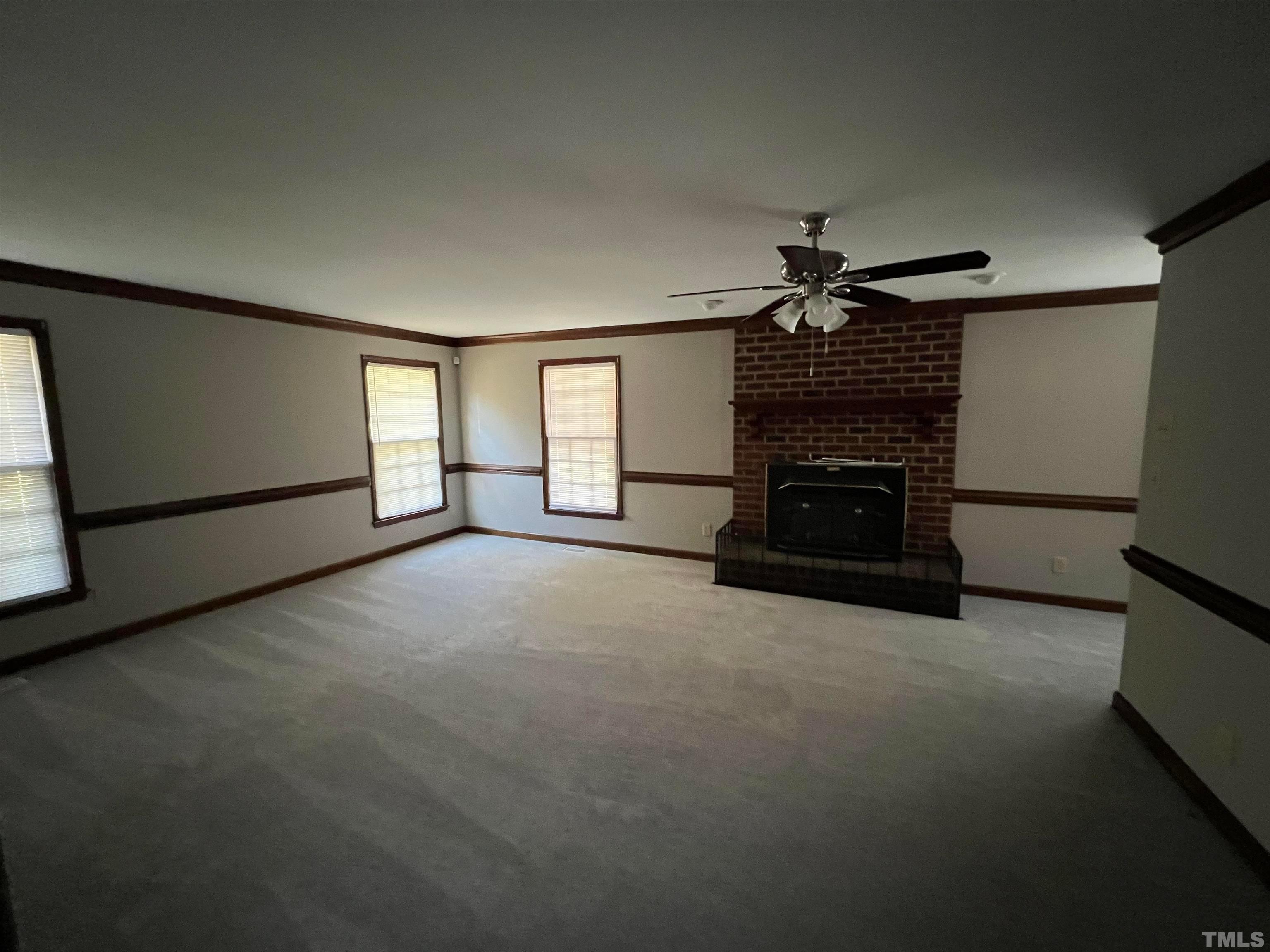 4359 Old Poole Road Raleigh, NC 27610 - Photo 4 of 13 a view of a livingroom with a fireplace