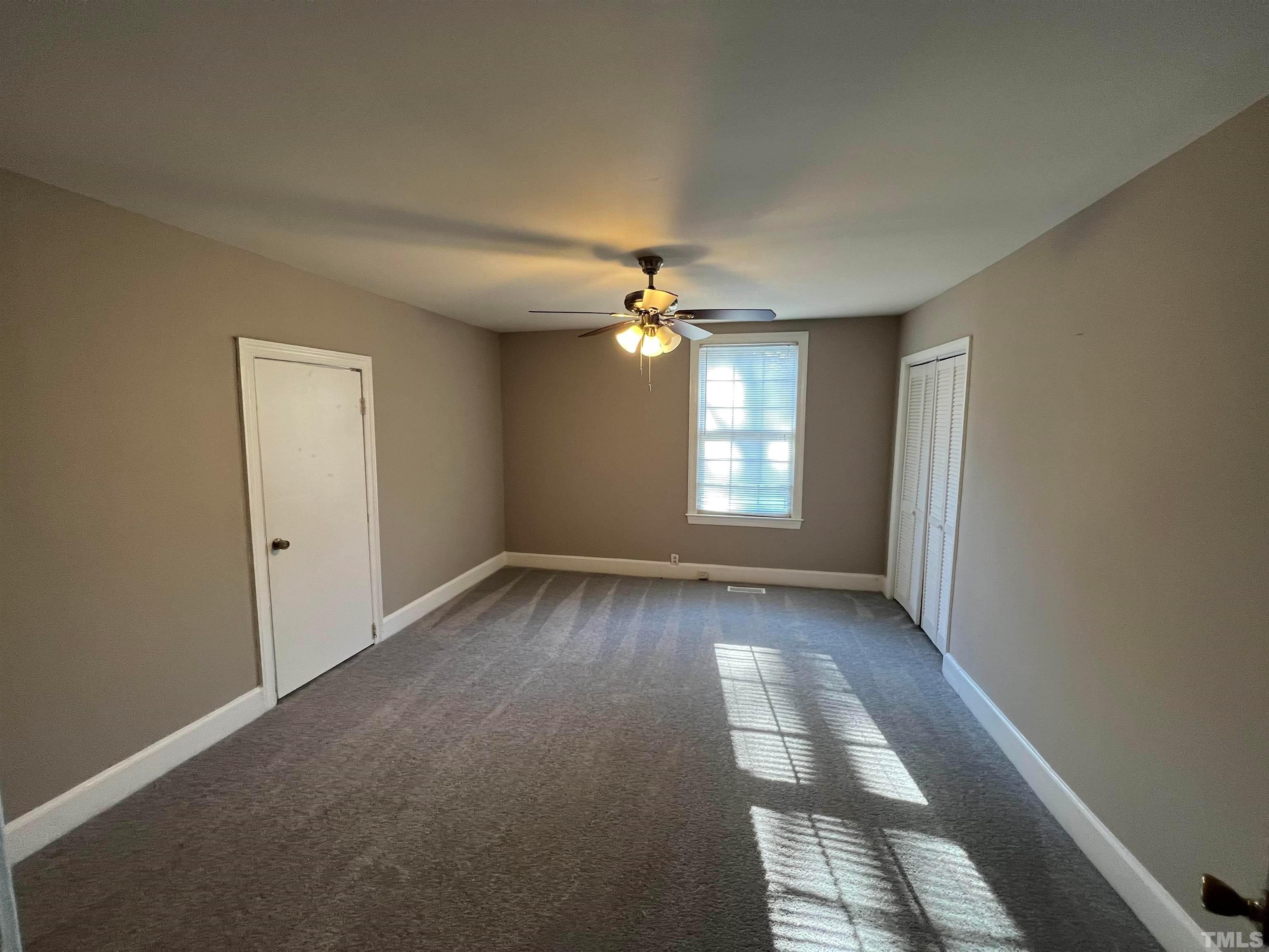 4359 Old Poole Road Raleigh, NC 27610 - Photo 5 of 13 a view of a livingroom with a ceiling fan and window