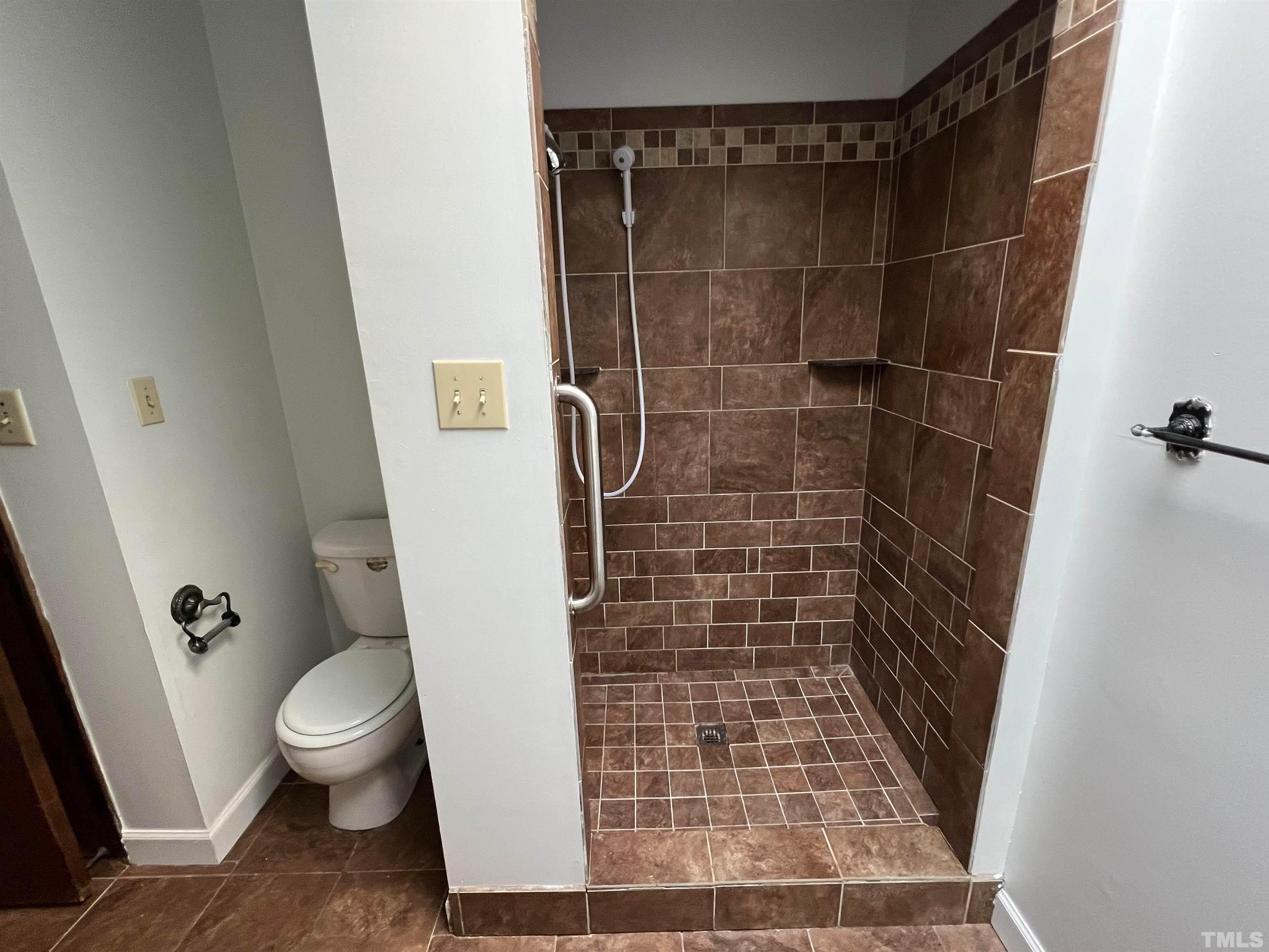 4359 Old Poole Road Raleigh, NC 27610 - Photo 6 of 13 a bathroom with a toilet and a shower