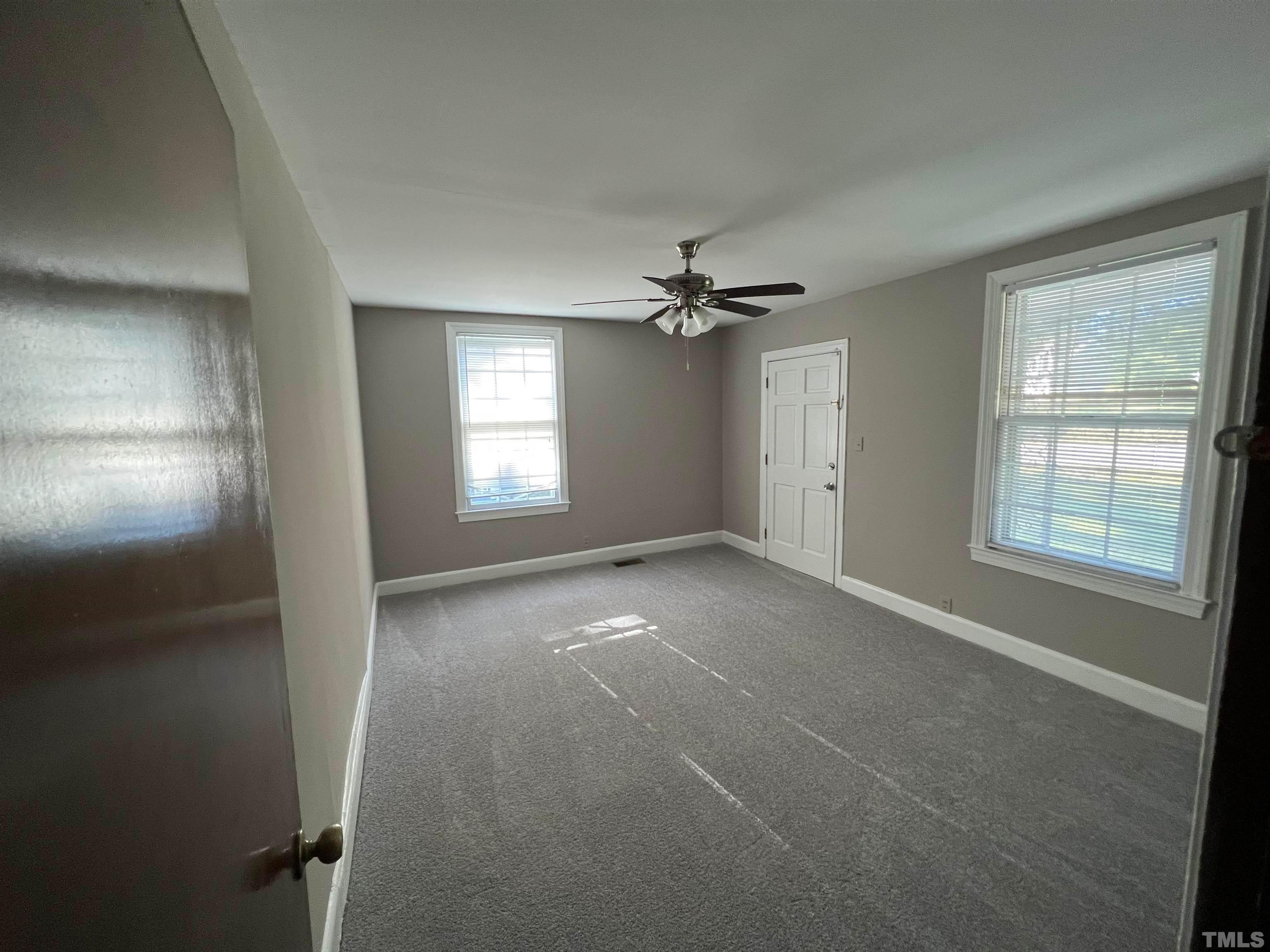 4359 Old Poole Road Raleigh, NC 27610 - Photo 8 of 13 a view of an empty room with a window