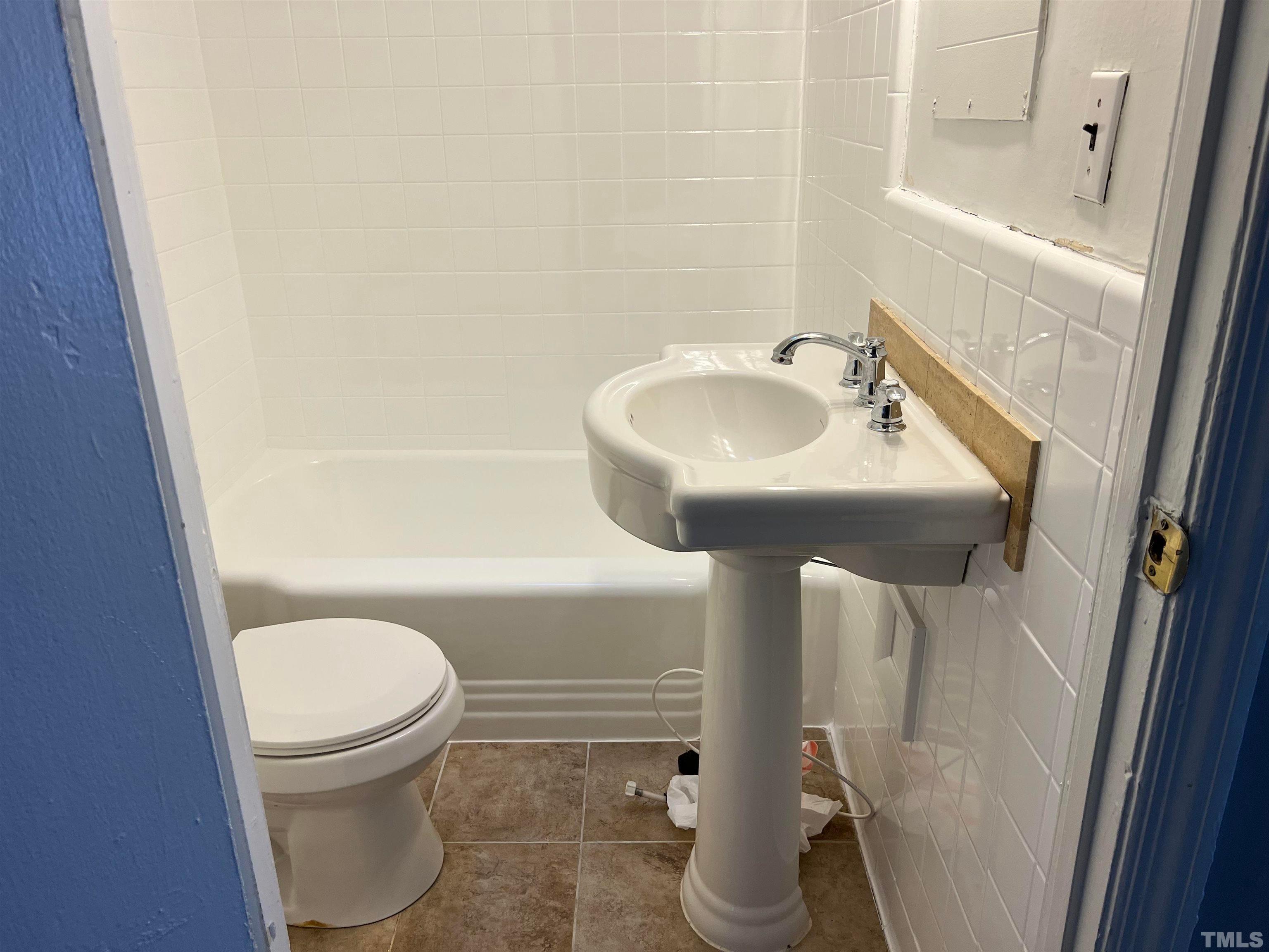 4359 Old Poole Road Raleigh, NC 27610 - Photo 10 of 13 a bathroom with a sink toilet and shower