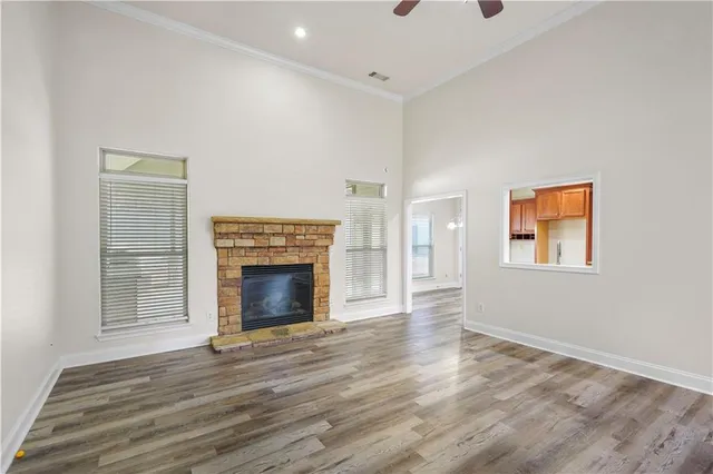 a large kitchen with stainless steel appliances kitchen island granite countertop a large counter top and wooden cabinets