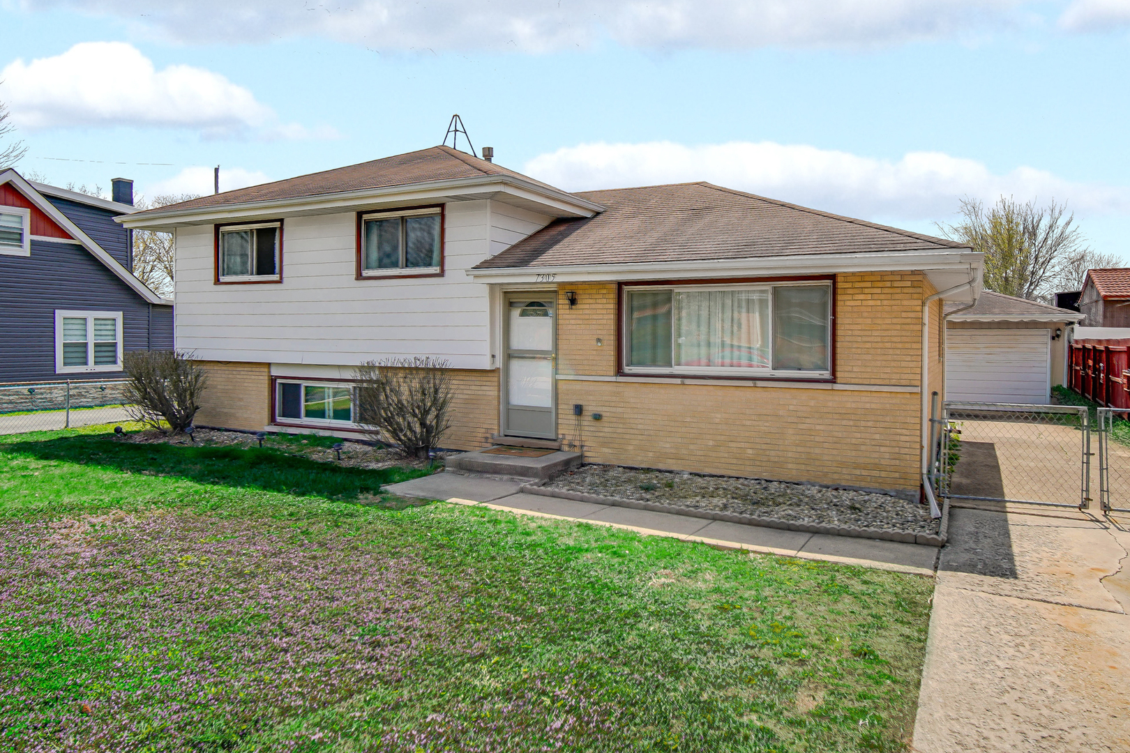 7305 West 75th Street Bridgeview, IL 60455 - Photo 1 of 22 front view of a house with a yard