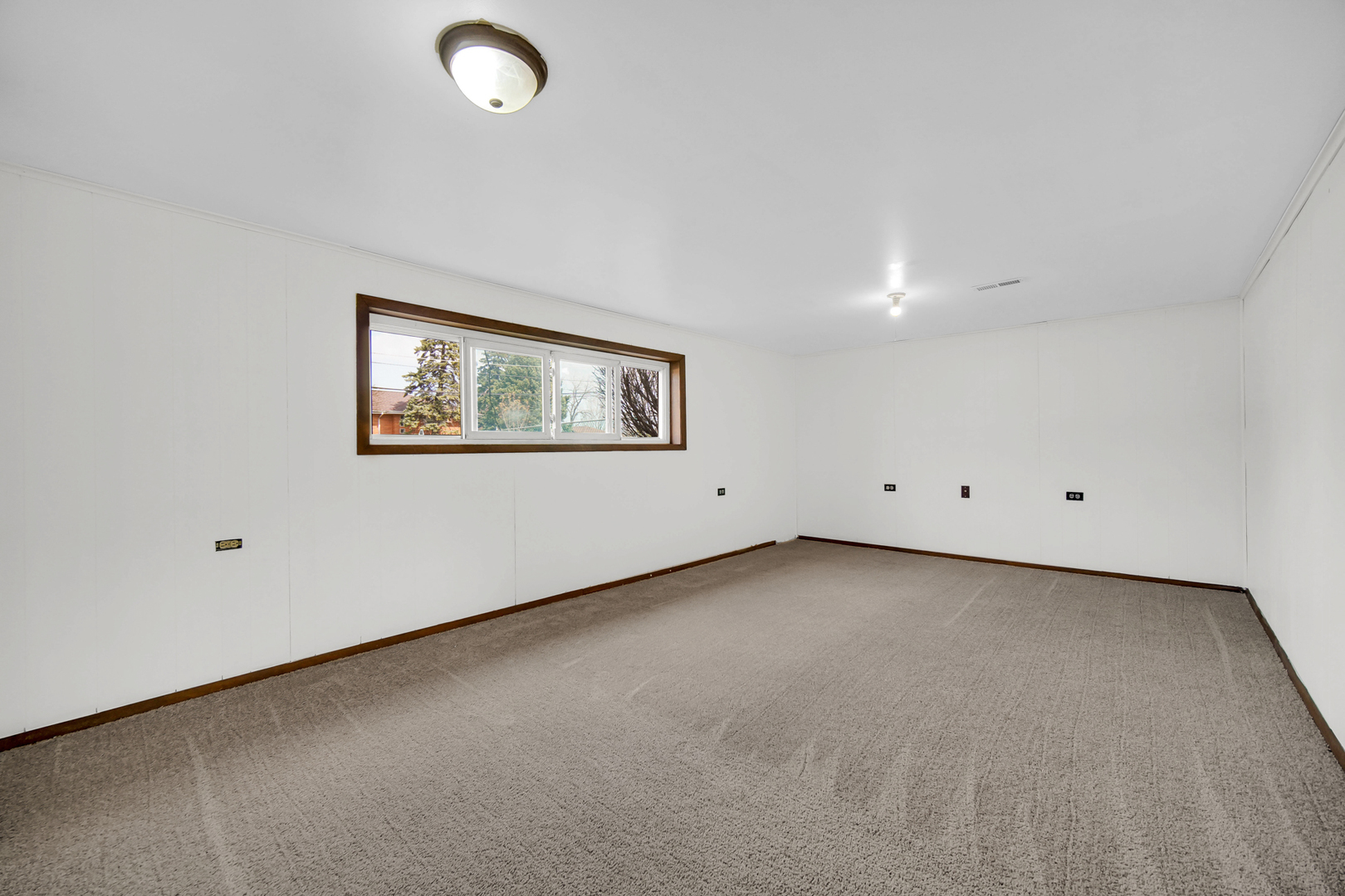 7305 West 75th Street Bridgeview, IL 60455 - Photo 13 of 22 an empty room with windows