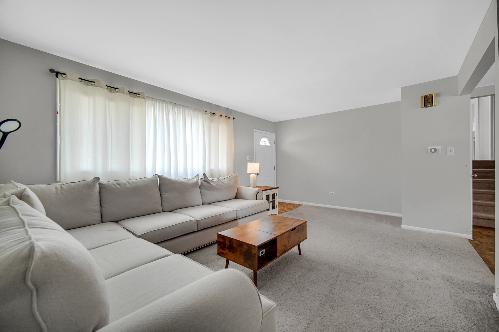 7305 West 75th Street Bridgeview, IL 60455 - Photo 5 of 22 a living room with furniture and a window