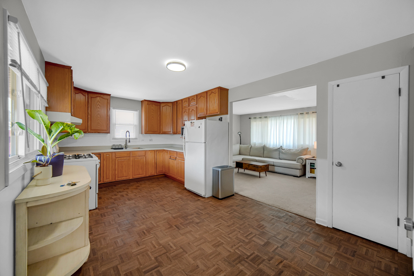 7305 West 75th Street Bridgeview, IL 60455 - Photo 7 of 22 a kitchen with a sink cabinets and appliances