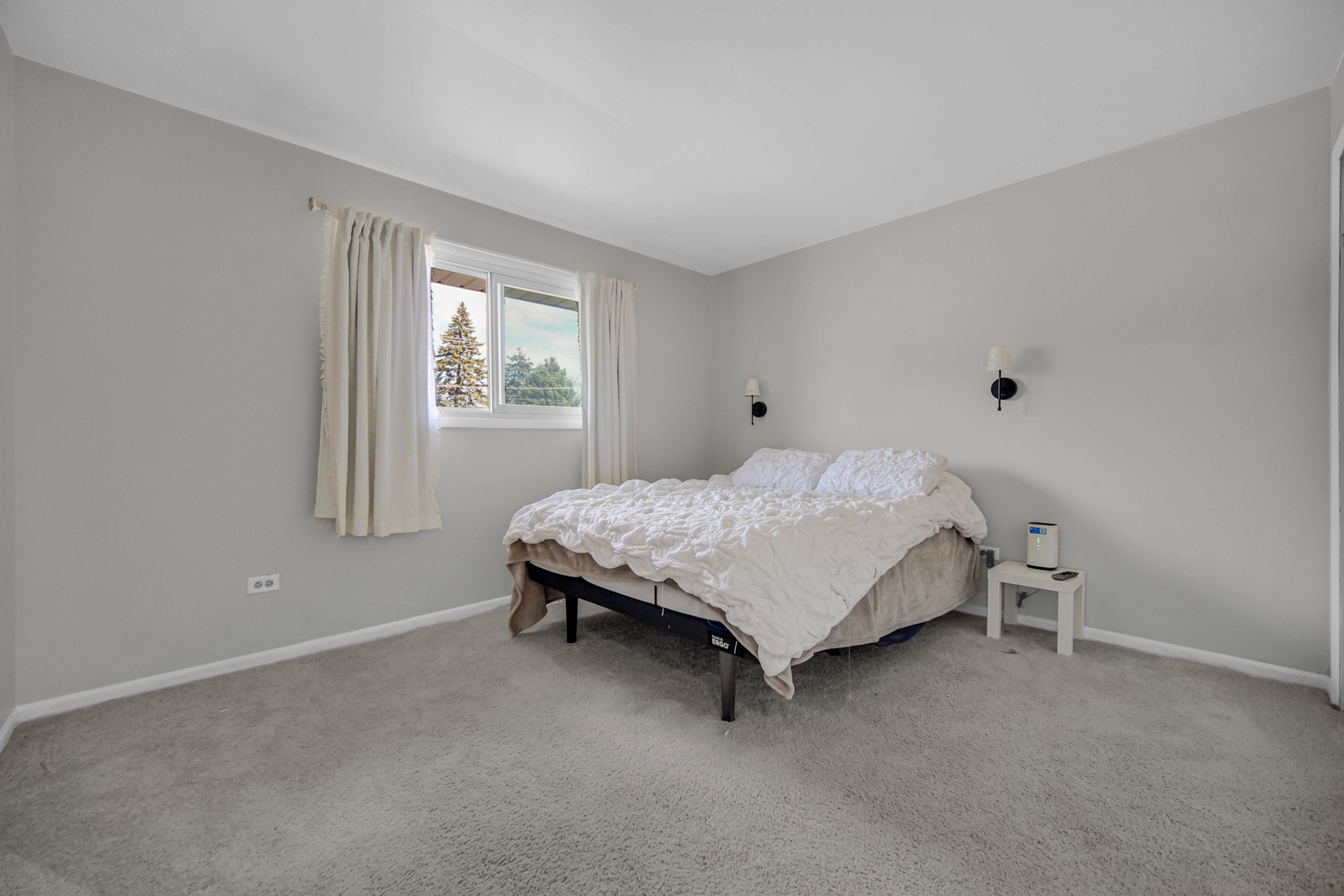 7305 West 75th Street Bridgeview, IL 60455 - Photo 10 of 22 a bedroom with a bed and a window