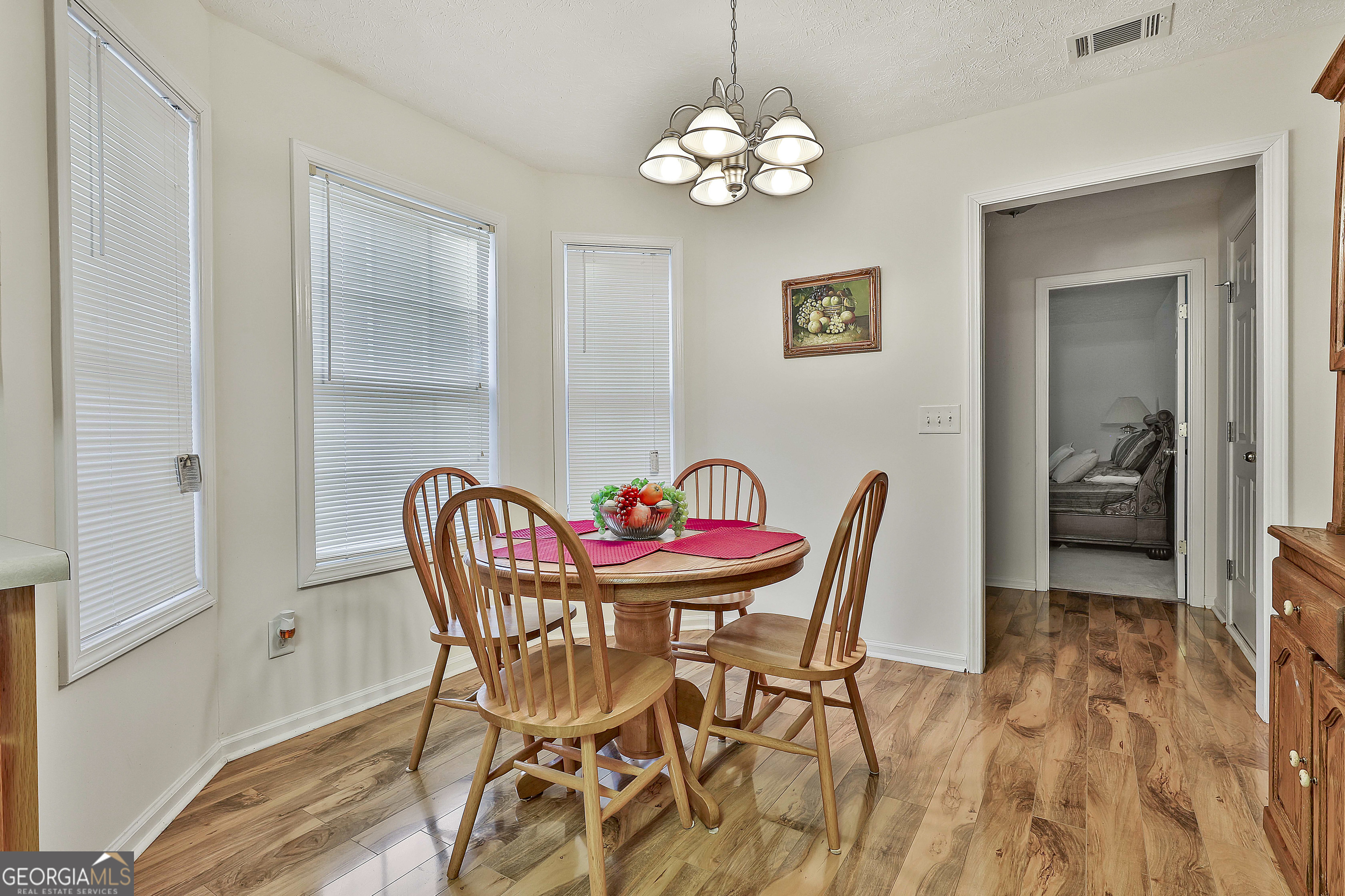 450 McKoy Road Newnan, GA 30263 - Photo 14 of 28 a dining room with furniture and chandelier