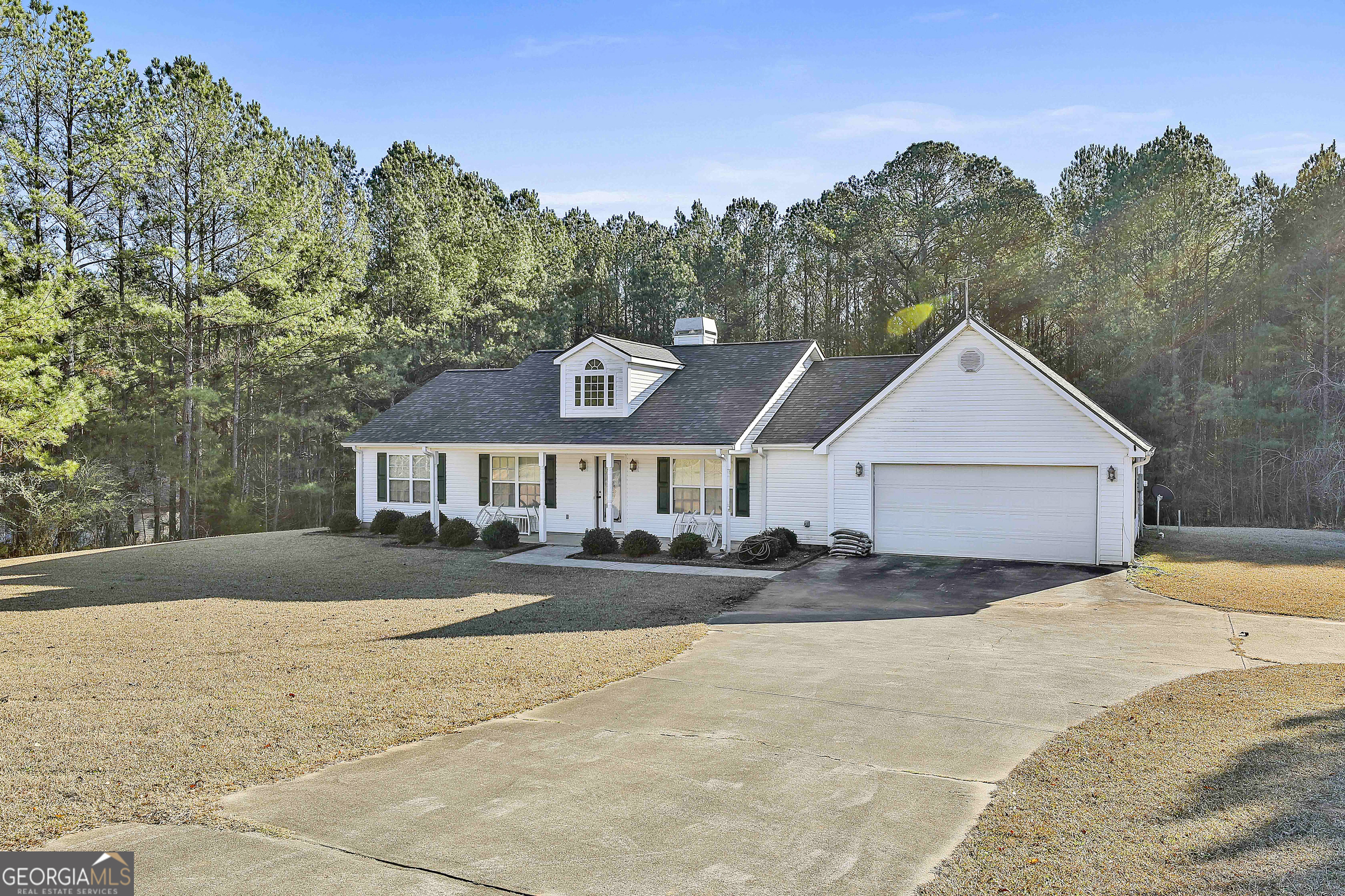 450 McKoy Road Newnan, GA 30263 - Photo 3 of 28 a front view of a house with a yard and trees