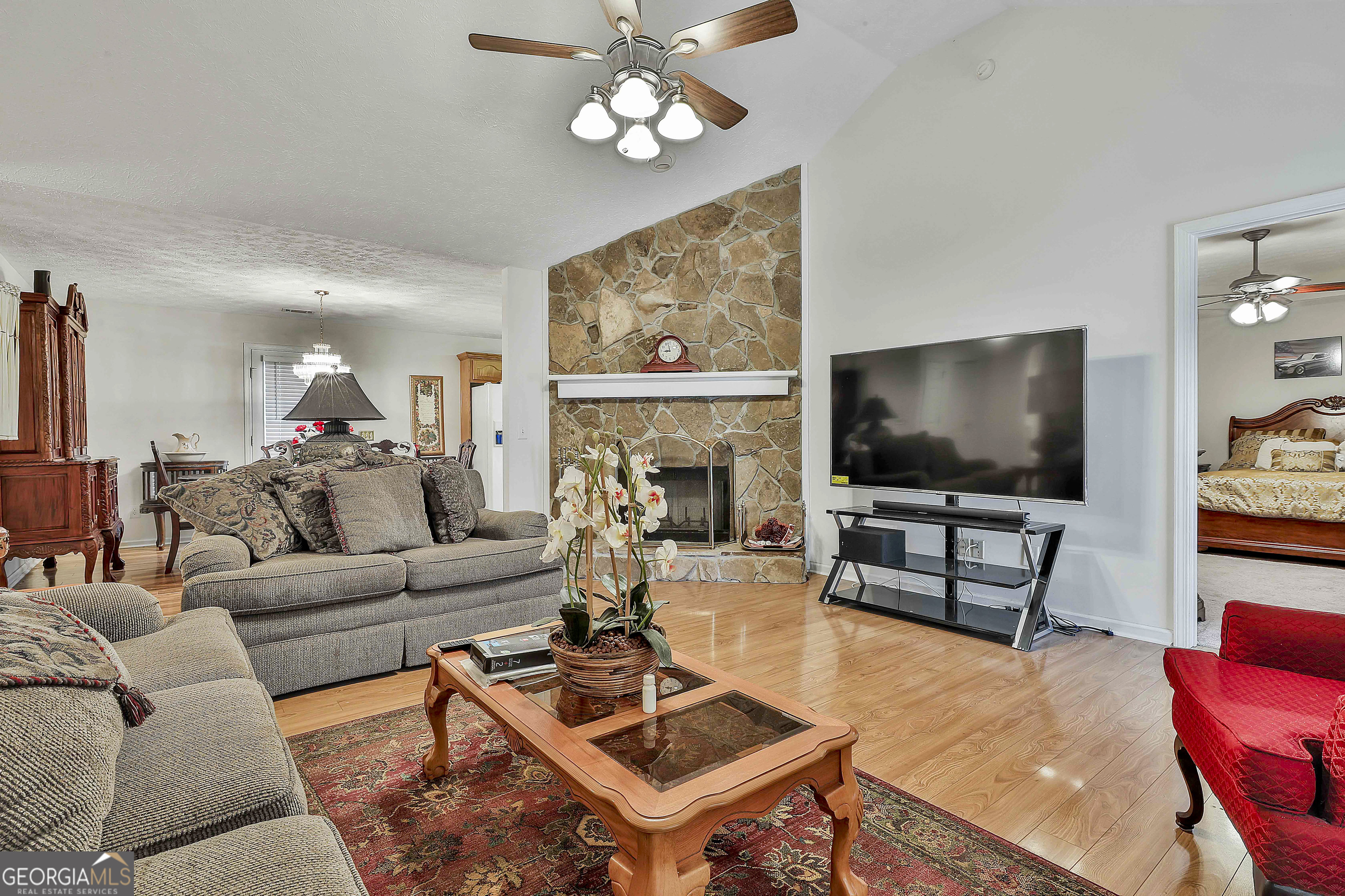 450 McKoy Road Newnan, GA 30263 - Photo 7 of 28 a living room with furniture and a flat screen tv