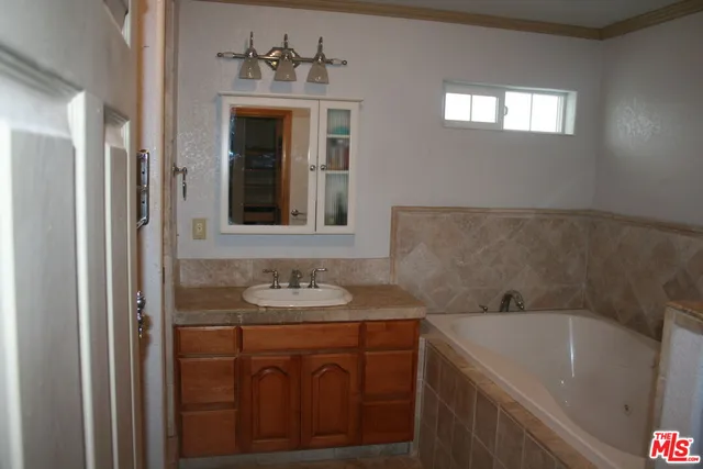 a bathroom with a toilet and a bathtub