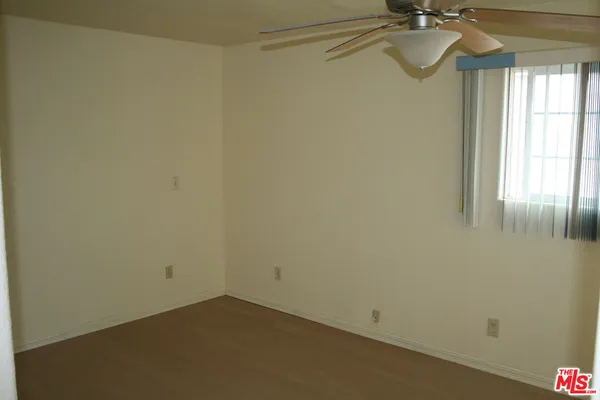 a living room with furniture and a large mirror