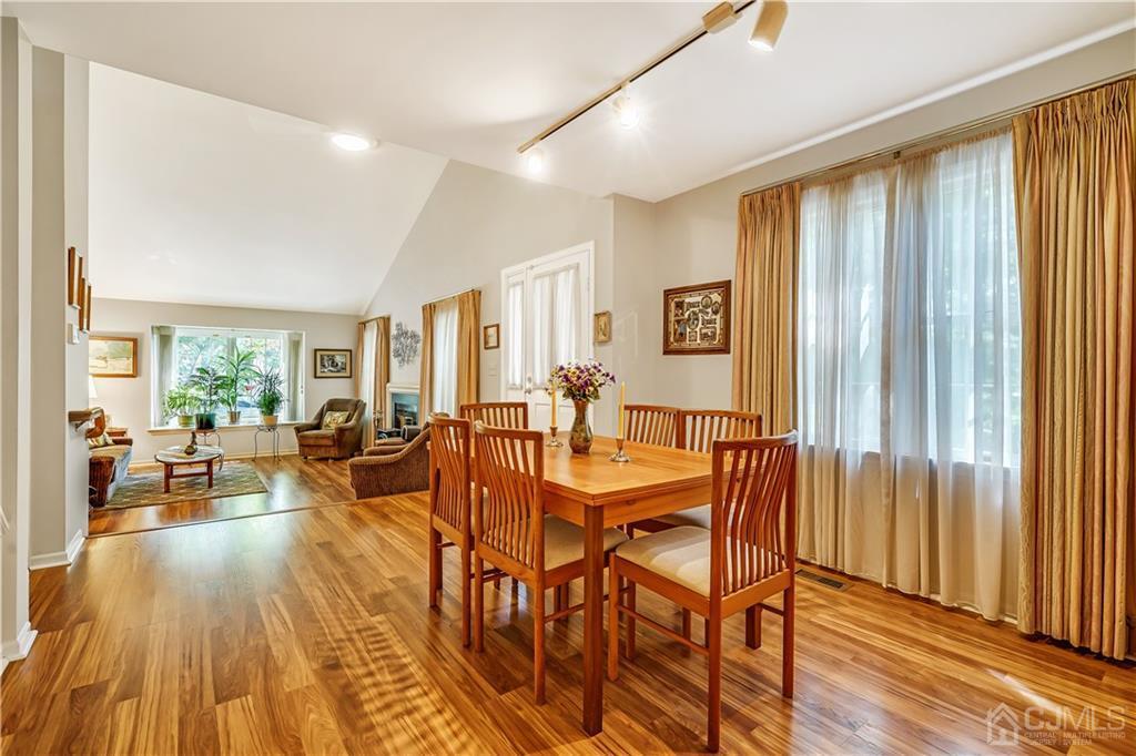 19 Stone Run Road Bedminster, NJ 07921 - Photo 4 of 17 a view of a dining room with furniture and wooden floor
