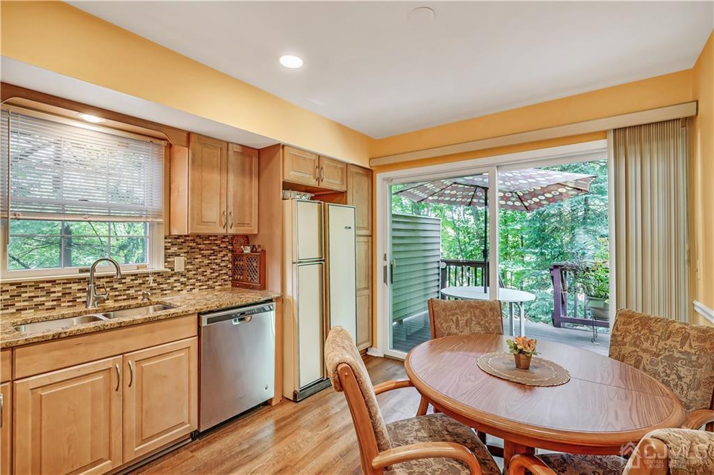 19 Stone Run Road Bedminster, NJ 07921 - Photo 7 of 17 a kitchen with a table chairs and wooden floor