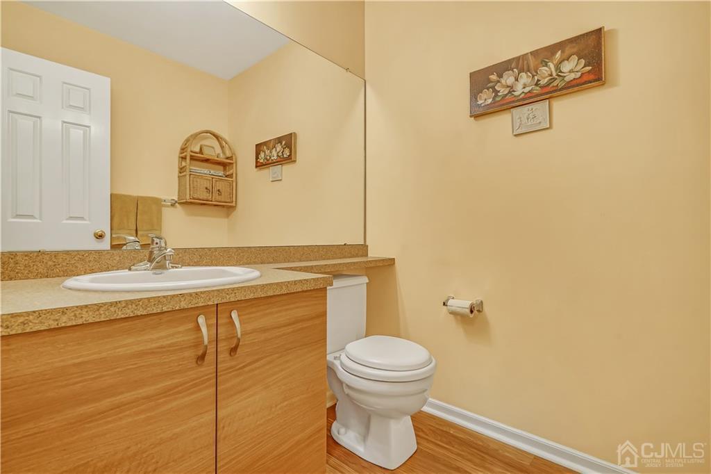 19 Stone Run Road Bedminster, NJ 07921 - Photo 8 of 17 a bathroom with a toilet sink and mirror