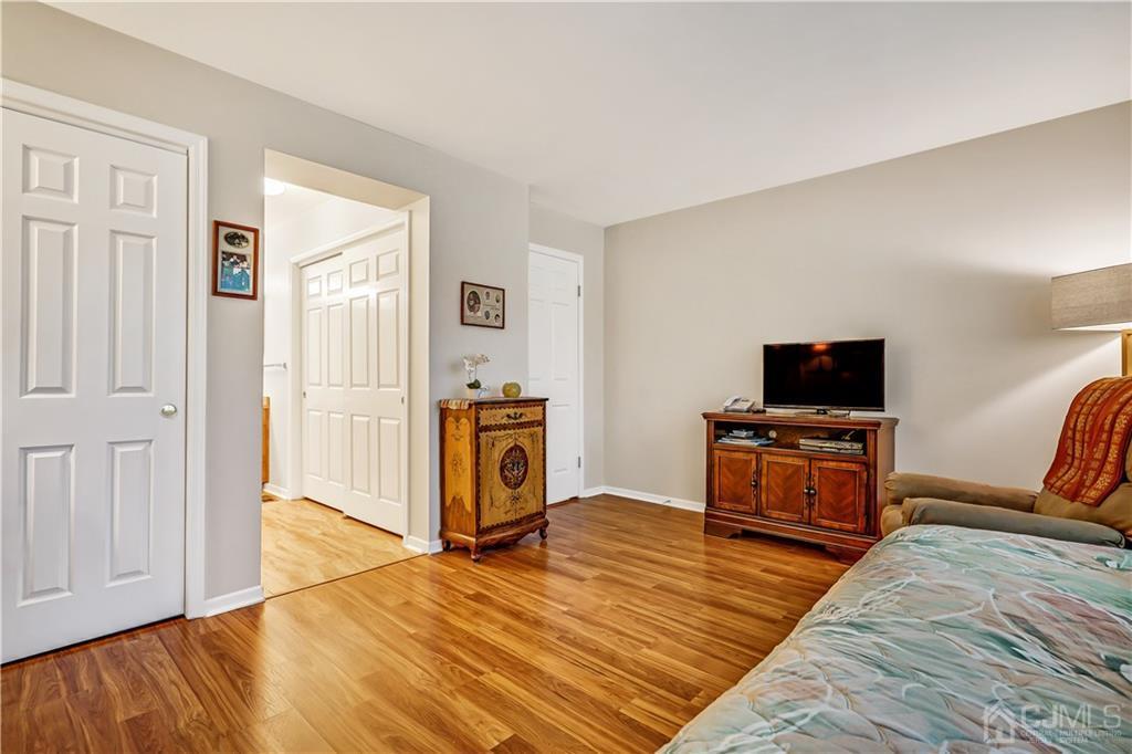 19 Stone Run Road Bedminster, NJ 07921 - Photo 10 of 17 a bedroom with furniture and a flat screen tv