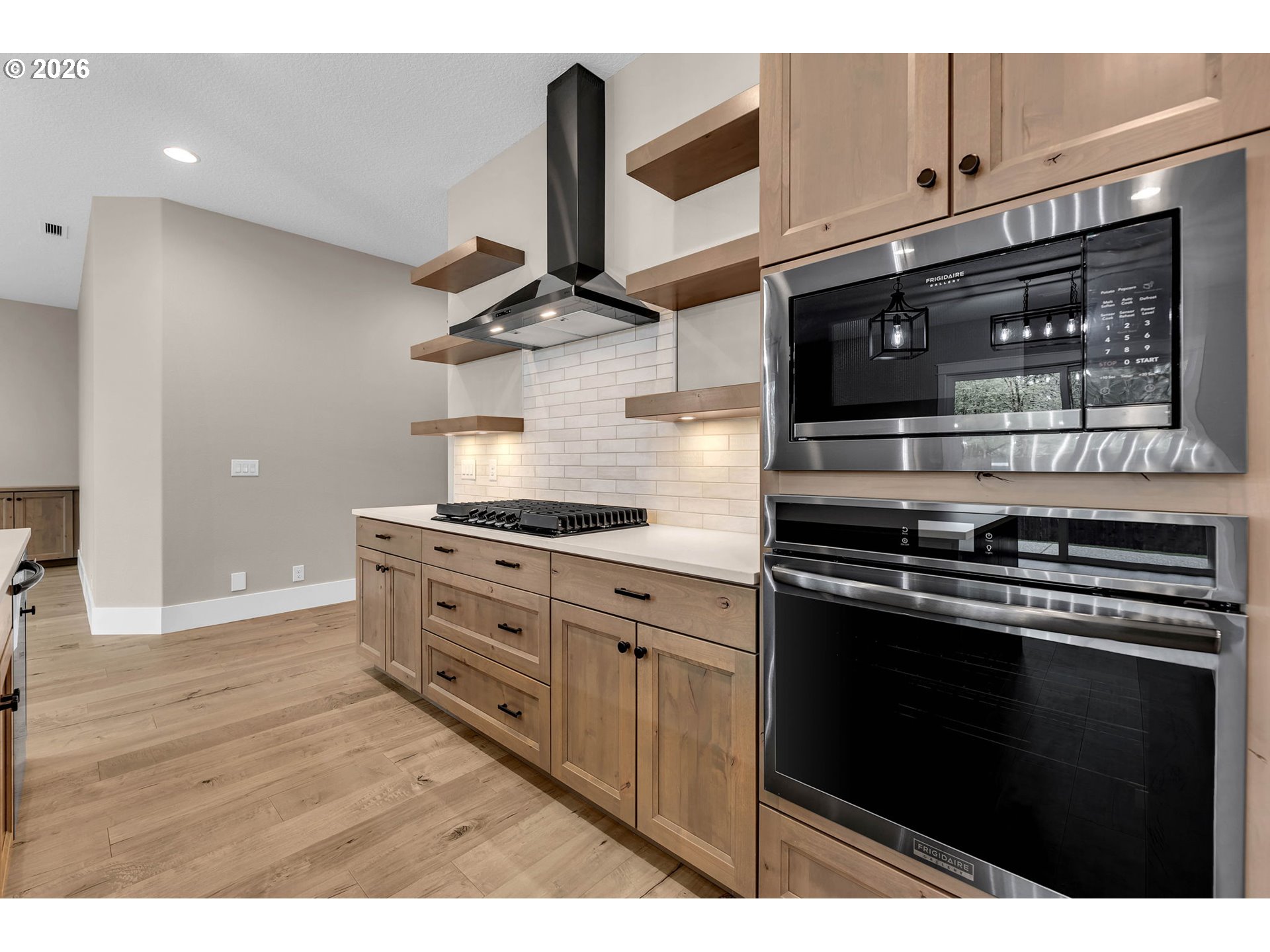 16221 Northeast 180th Street Brush Prairie, WA 98606 - Photo 12 of 47 a kitchen with stainless steel appliances granite countertop a stove and a microwave