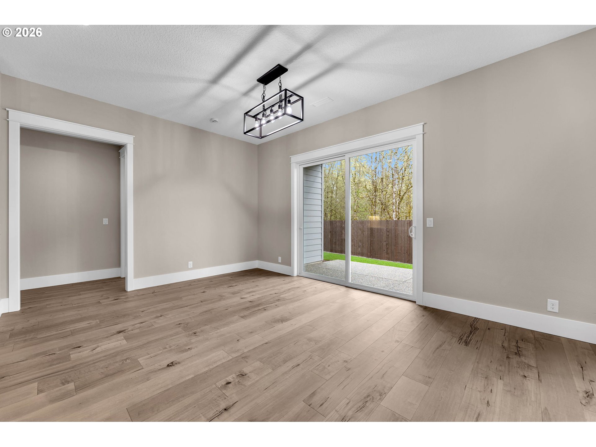 16221 Northeast 180th Street Brush Prairie, WA 98606 - Photo 18 of 47 a view of an empty room with wooden floor