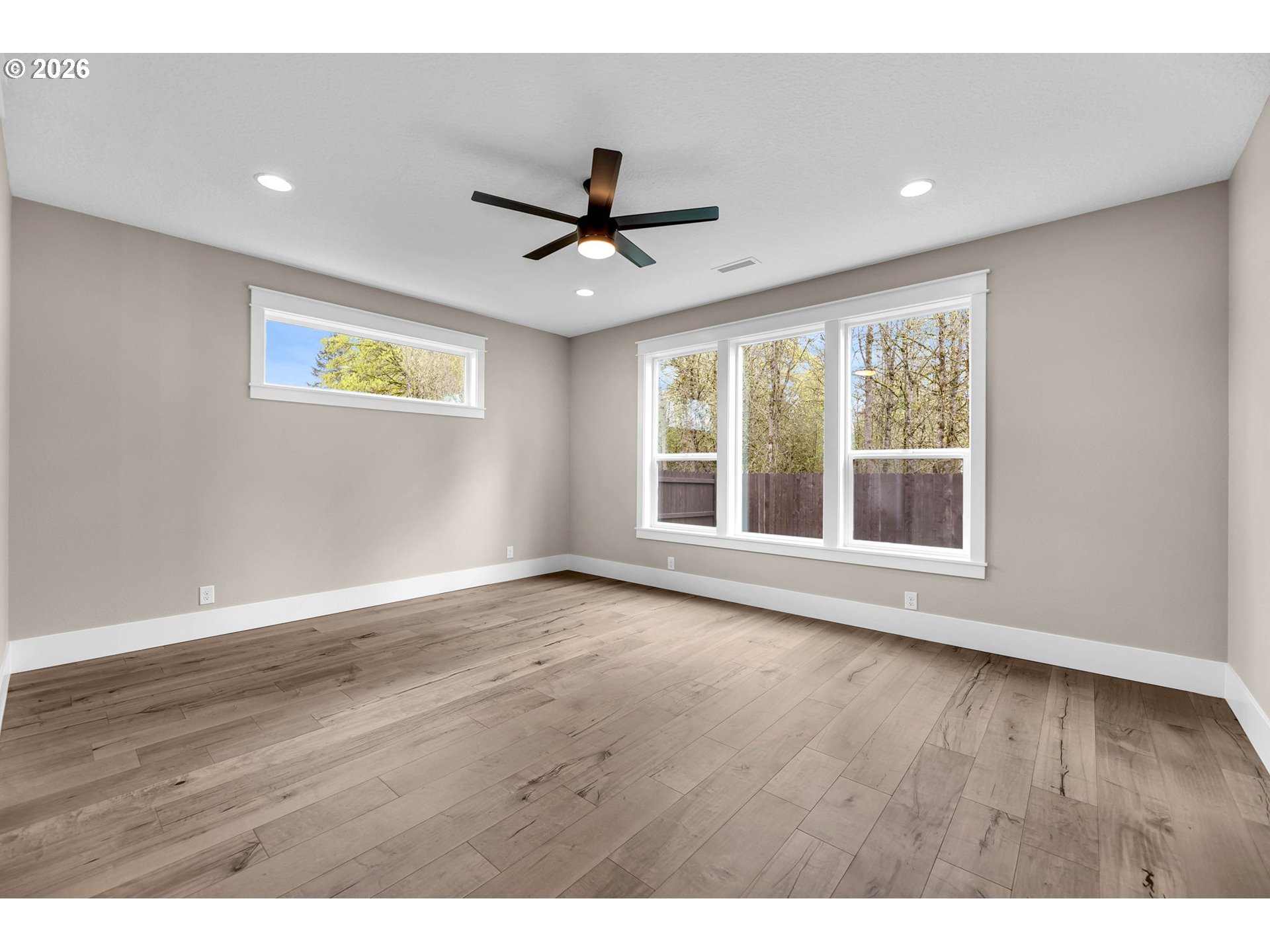 16221 Northeast 180th Street Brush Prairie, WA 98606 - Photo 19 of 47 a view of an empty room with a window and wooden floor