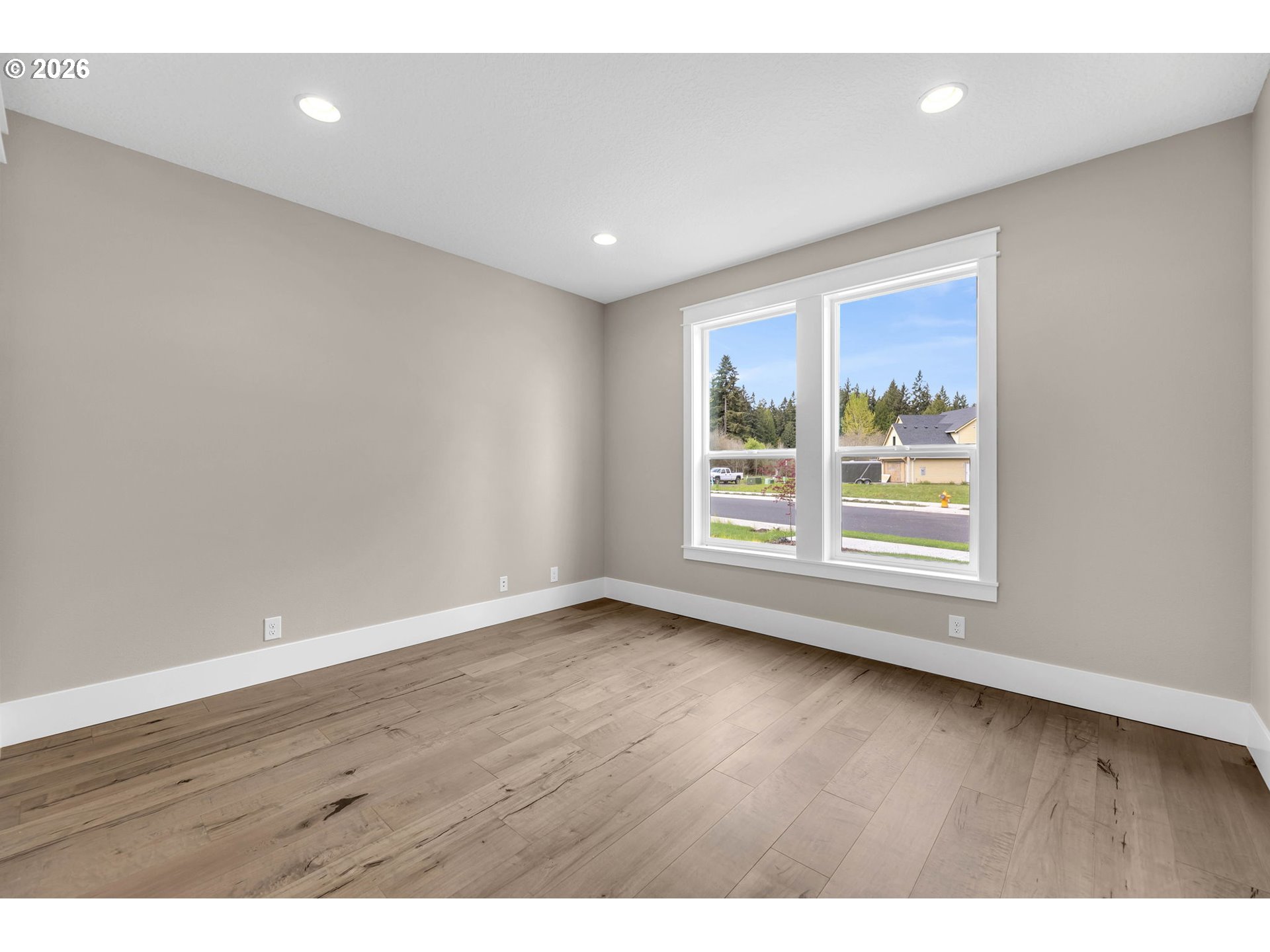 16221 Northeast 180th Street Brush Prairie, WA 98606 - Photo 30 of 47 a view of an empty room with wooden floor and a window