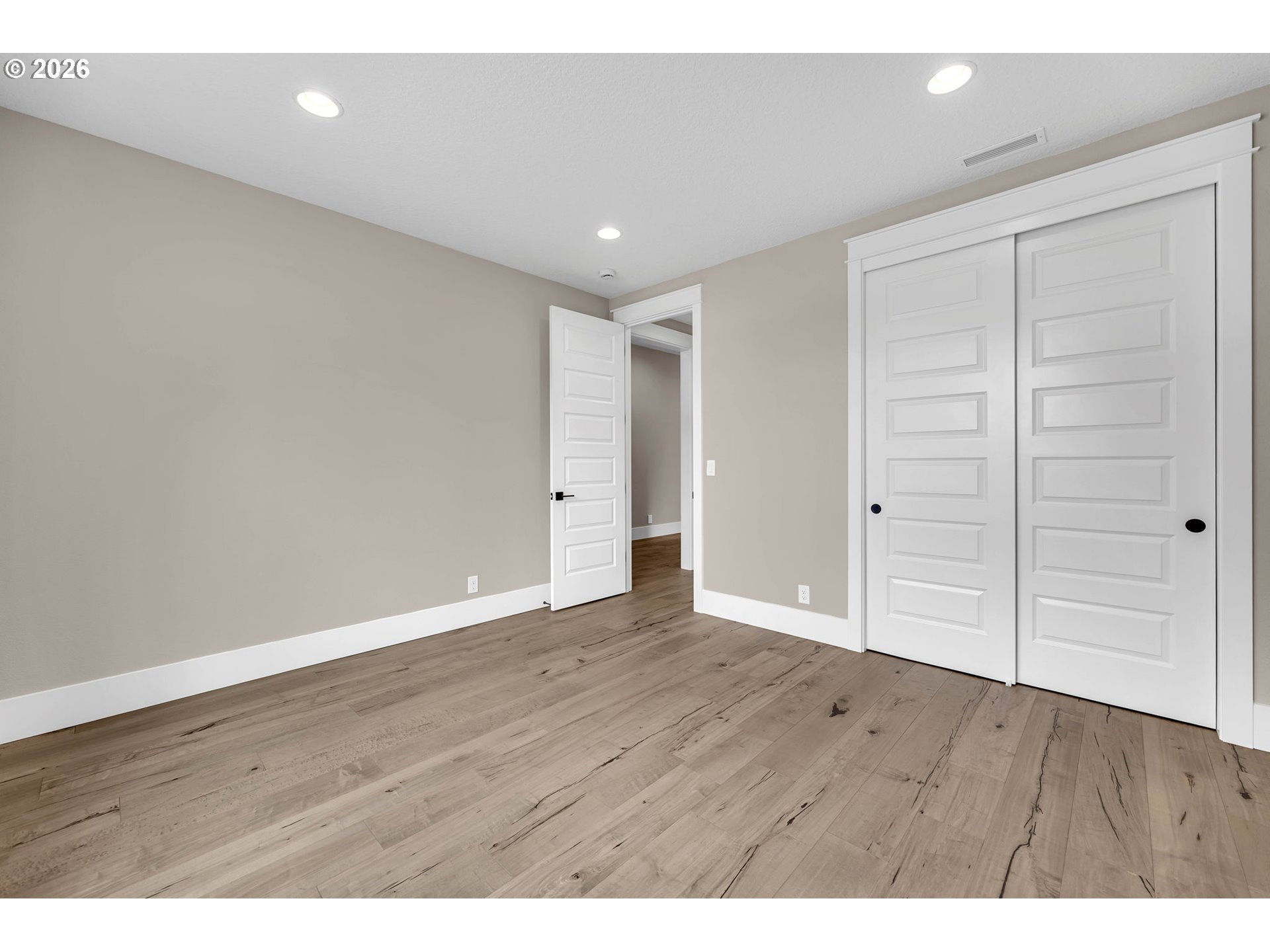 16221 Northeast 180th Street Brush Prairie, WA 98606 - Photo 31 of 47 a view of an empty room with wooden floor