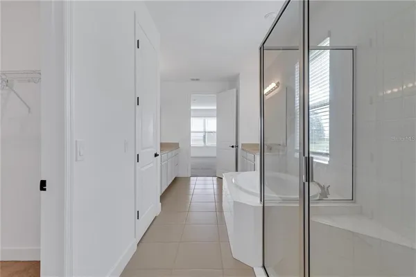 a bathroom with a glass shower door