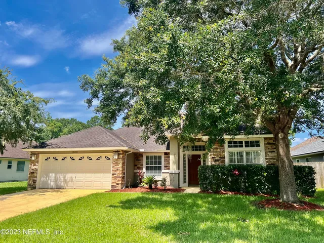 front view of a house with a yard
