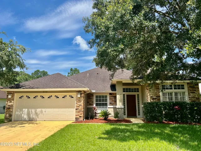 front view of a house with a yard