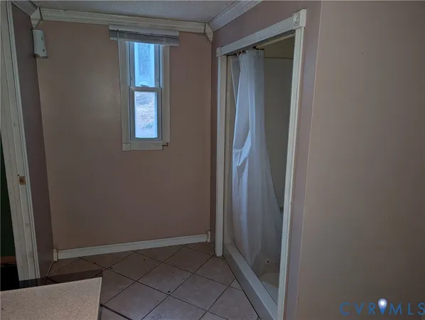 a view of a small space with wooden floor