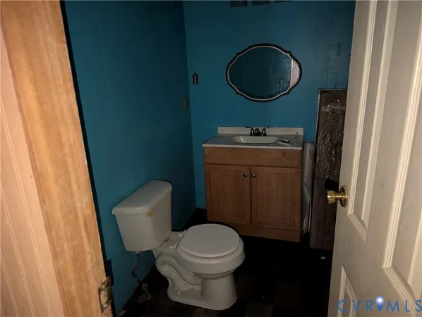 a room with wooden floor and a window