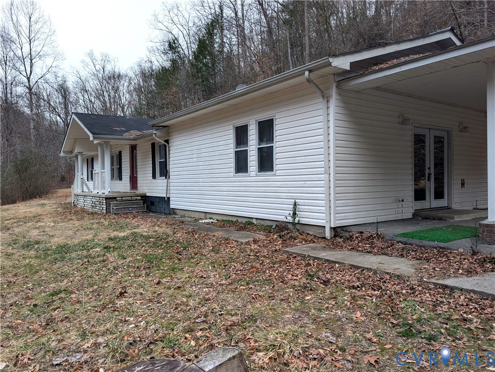 1149 Woodcrest Road Hurley, VA 24620 - Photo 2 of 32 a front view of a house with garden