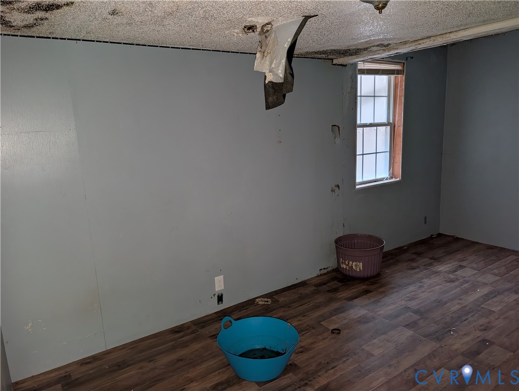 1149 Woodcrest Road Hurley, VA 24620 - Photo 21 of 32 a room with wooden floor and a window