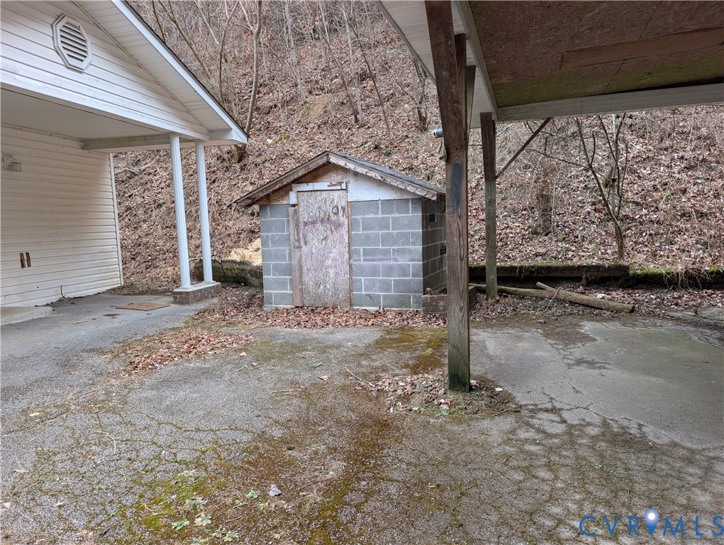 1149 Woodcrest Road Hurley, VA 24620 - Photo 27 of 32 a view of a house with a backyard