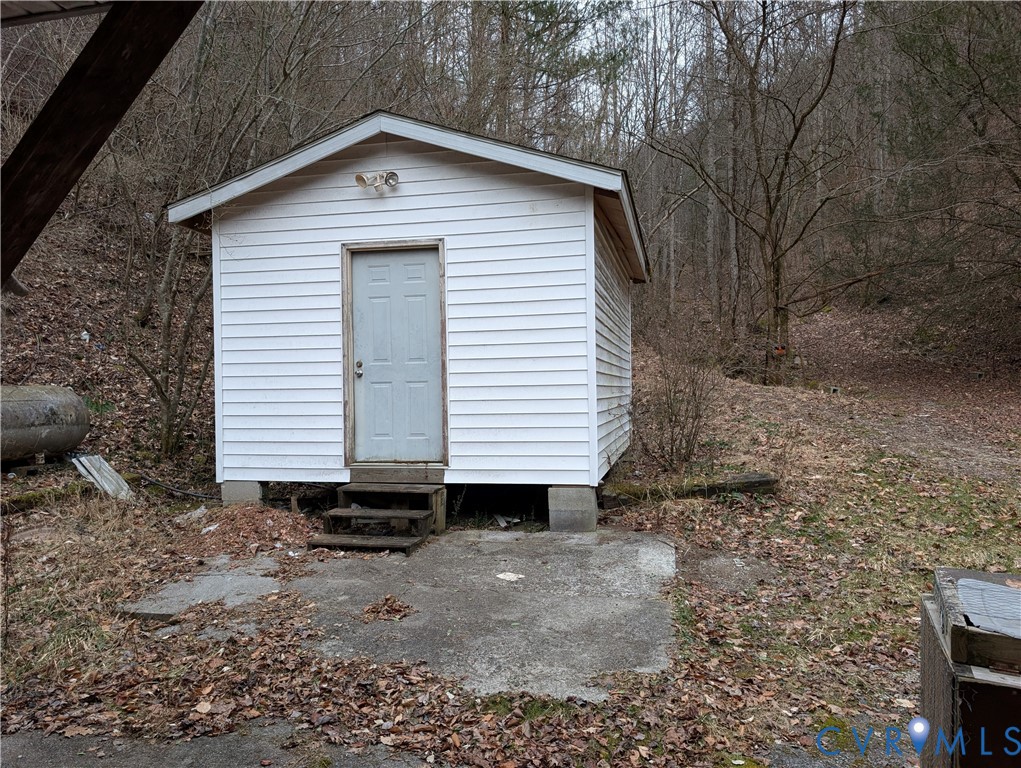 1149 Woodcrest Road Hurley, VA 24620 - Photo 29 of 32 a small white house with a outdoor space