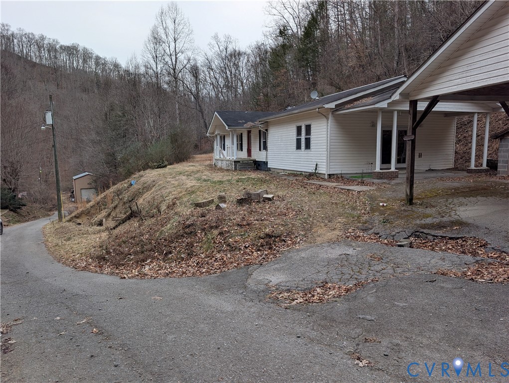 1149 Woodcrest Road Hurley, VA 24620 - Photo 31 of 32 a view of a house with a backyard