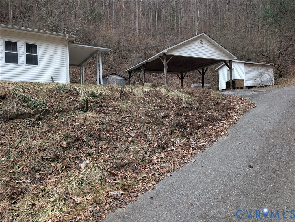 1149 Woodcrest Road Hurley, VA 24620 - Photo 32 of 32 a house with trees in the background