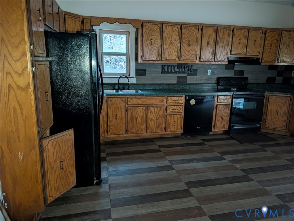 1149 Woodcrest Road Hurley, VA 24620 - Photo 8 of 32 a kitchen with granite countertop a refrigerator a stove and a microwave oven