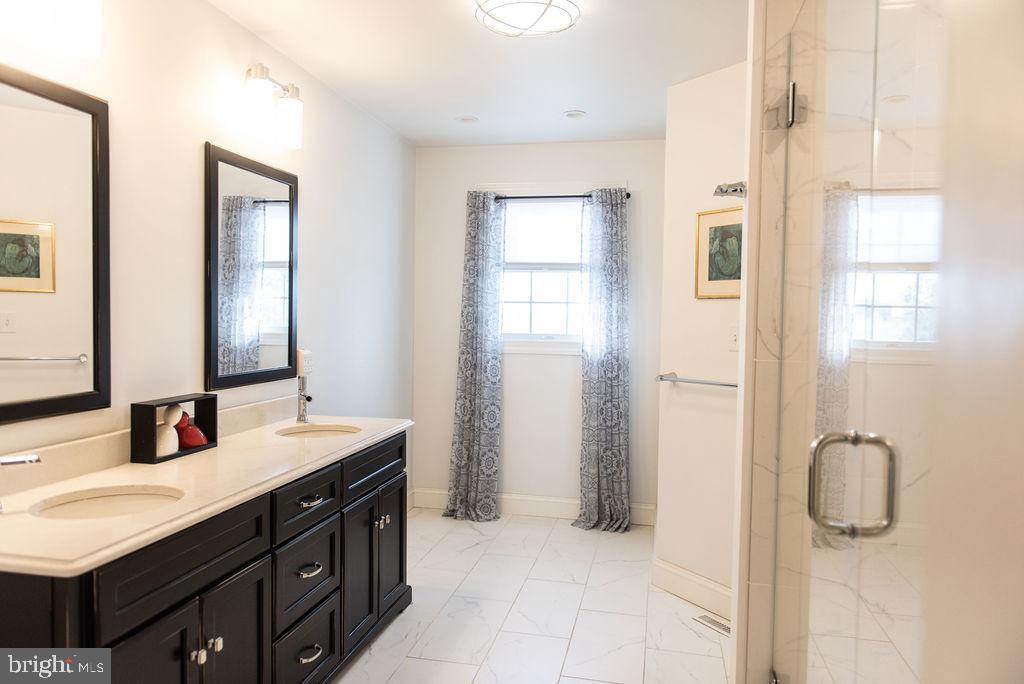565 Sand Hill Road Hershey, PA 17033 - Photo 15 of 27 a bathroom with a double vanity sink mirror and shower