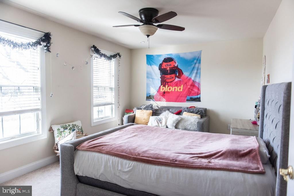 565 Sand Hill Road Hershey, PA 17033 - Photo 17 of 27 a bedroom with a bed and a chandelier