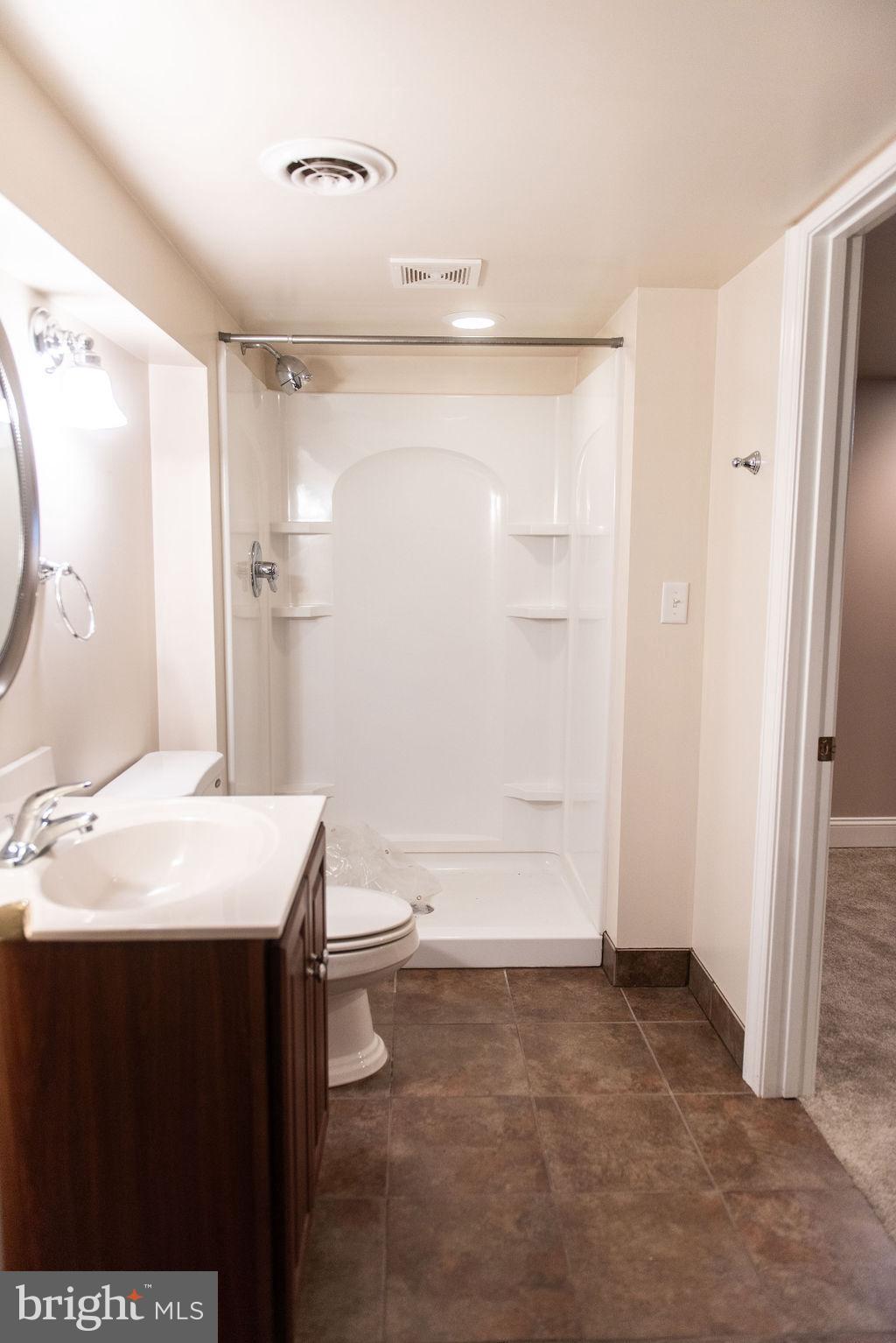 565 Sand Hill Road Hershey, PA 17033 - Photo 24 of 27 a bathroom with a sink a toilet and shower