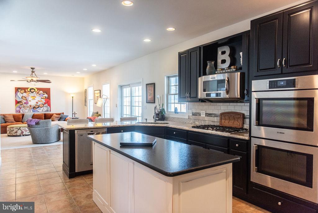 565 Sand Hill Road Hershey, PA 17033 - Photo 6 of 27 a kitchen with a sink stove and microwave