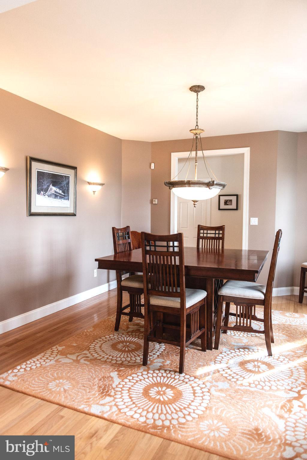 565 Sand Hill Road Hershey, PA 17033 - Photo 9 of 27 a dining room with a wooden table and chairs