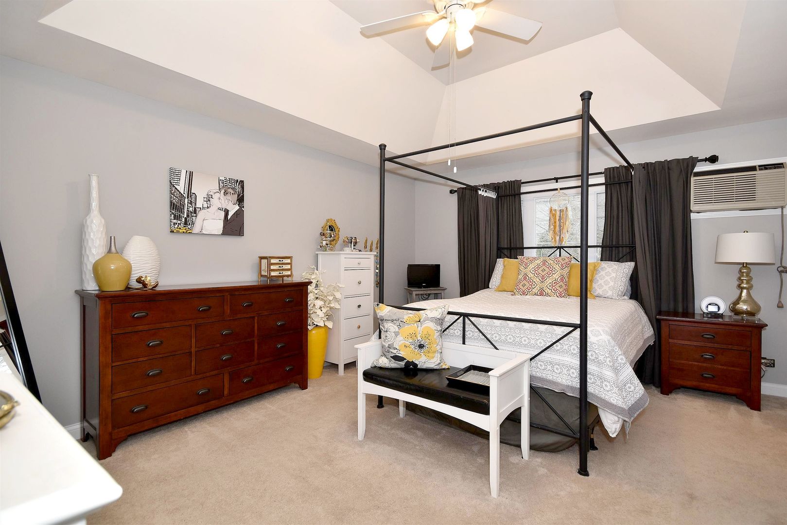 533 Lavina Drive Bolingbrook, IL 60440 - Photo 15 of 44 a bedroom with a bed and a chandelier